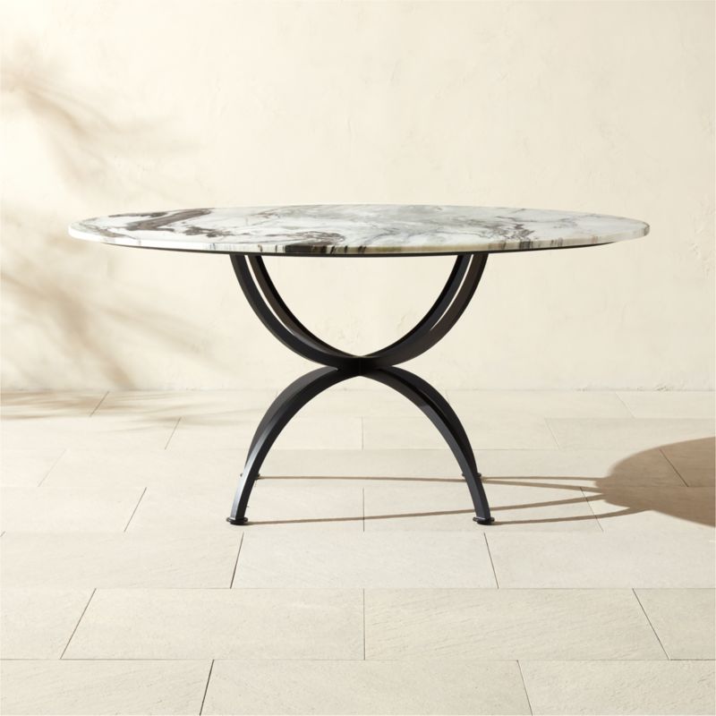 Colima 60" Round Black Metal Outdoor Dining Table with Marble Top | CB2 added by Spoak Member