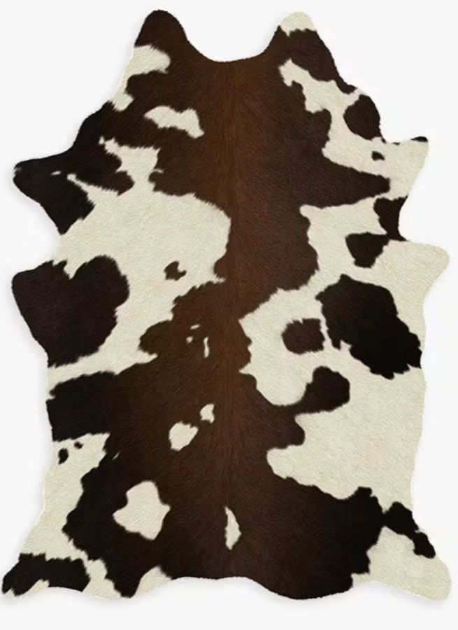 Brown & Black Faux Cowhide Rug | Ruggable added by Rachael Igoe