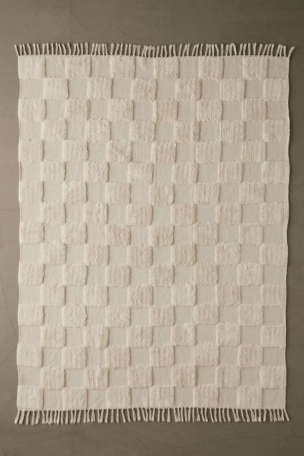 Tufted rug added by Ashley Sere