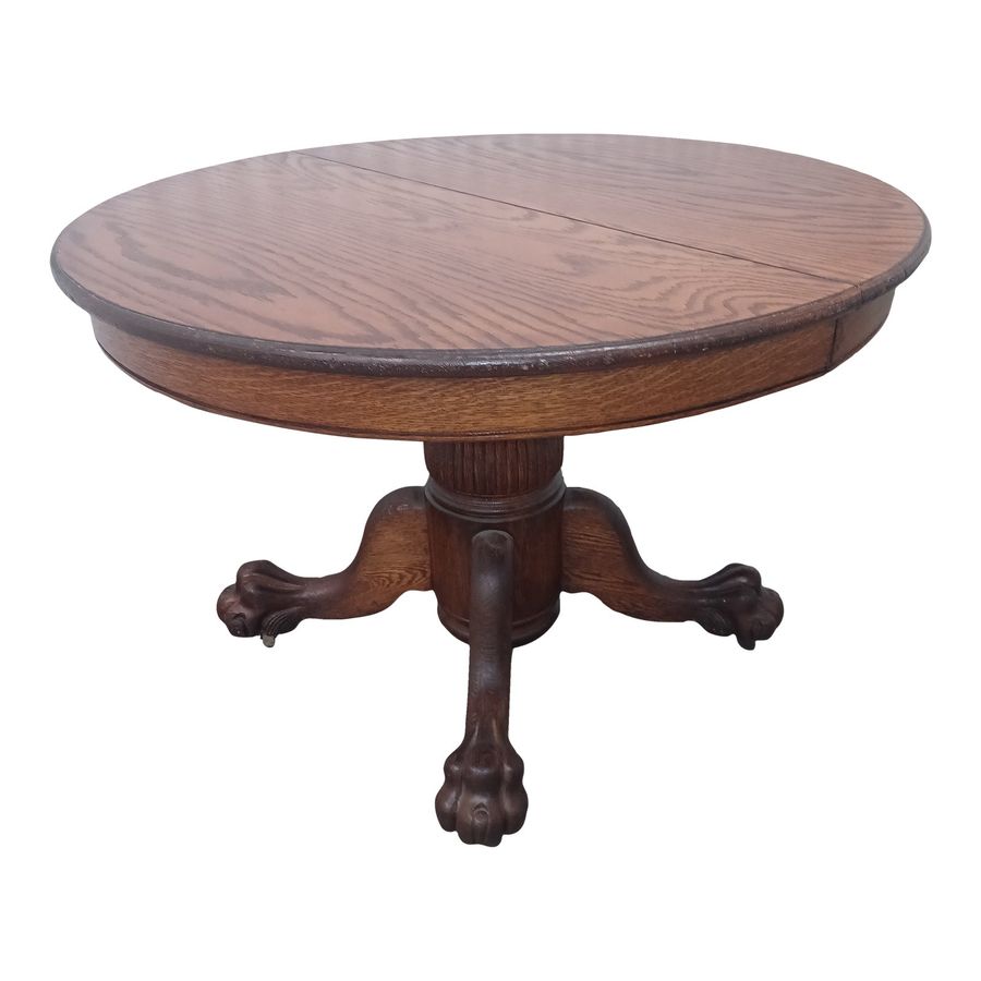 Late 19th Century Round Tiger Oak Dining Table With Lion Paw Feet added by Carley-Beth Castro