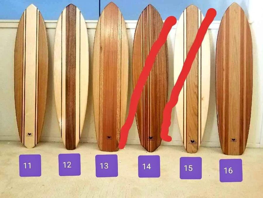 Custom wood surfboard wall art added by Lauren Kunewa