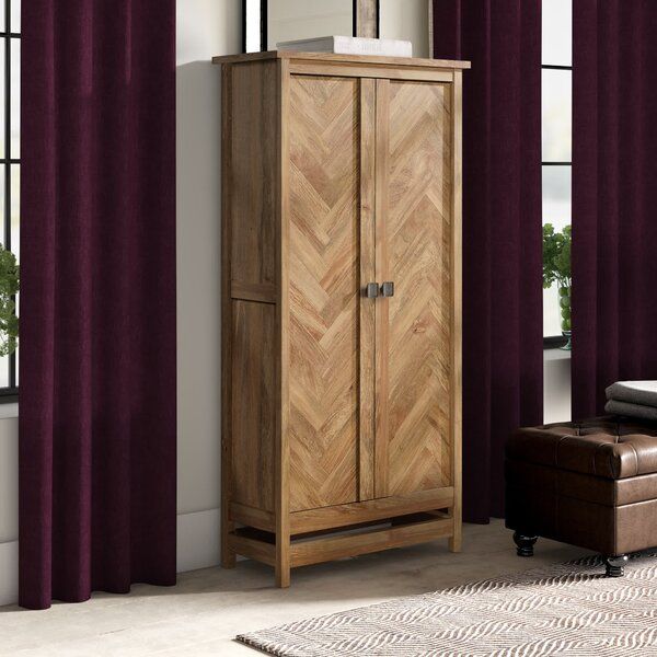 Casuarina Manufactured Wood Armoire added by Samantha Erickson