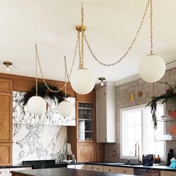 Swag Chandelier: Brass Chain with Neckless Globe Shades added by Haley Kuc