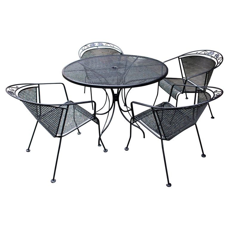 Vintage Woodard Four Chair and Round Table Set added by Ali Dyer