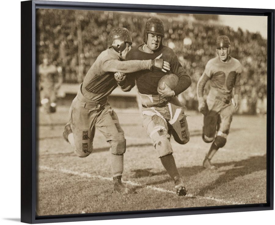 1920's football action. Hundreds of spectators watch from stadium seats added by Erin Vernon