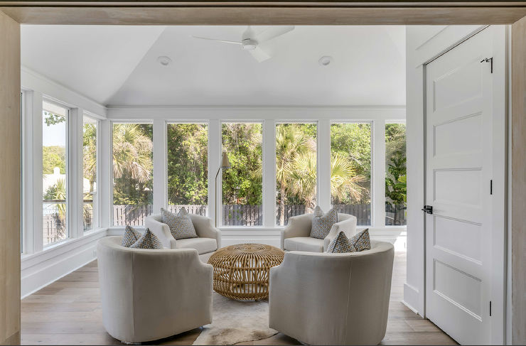 Beige Swivel Chairs with Round Rattan Coffee Table - Transitional - Living Room added by KATHERINE ECK