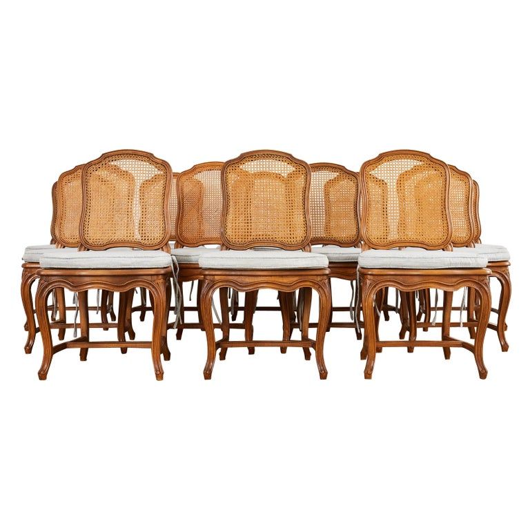 Set of Twelve Country French Provincial Fruitwood Caned Dining Chairs added by Spoak Member