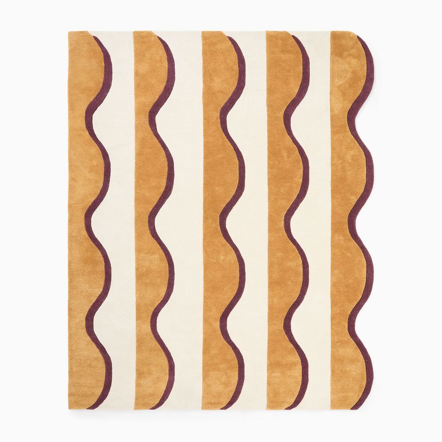 Geometric rug added by Hilah Stahl