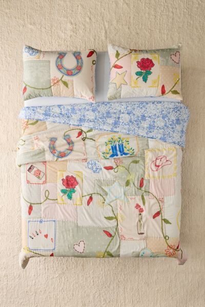 Whimsical Icons Patchwork Reversible Quilt added by Holly Larzelier