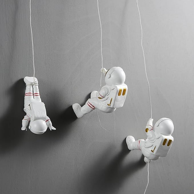 AWNR 3Pcs Climbing Astronaut Figurine Wall Hanging Decor Modern Home Decor Outer Space Theme Decorations Wall Sculptures Space Decor Background 3D Wall Decor for Bedroom Living Room Kids Room added by Jamie Stellato
