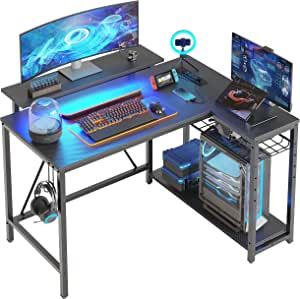 Bestier Small L Shaped Gaming Desk with Power Outlets,42 inch LED Computer Desk with Monitor Stand Reversible Storage Shelves Corner Gamer Desk with Headset Hooks USB Charging Port,Carbon Fiber Black added by Brittany Lemcke